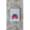 Porsche 356 Dinky Toys sur un mur en pierre